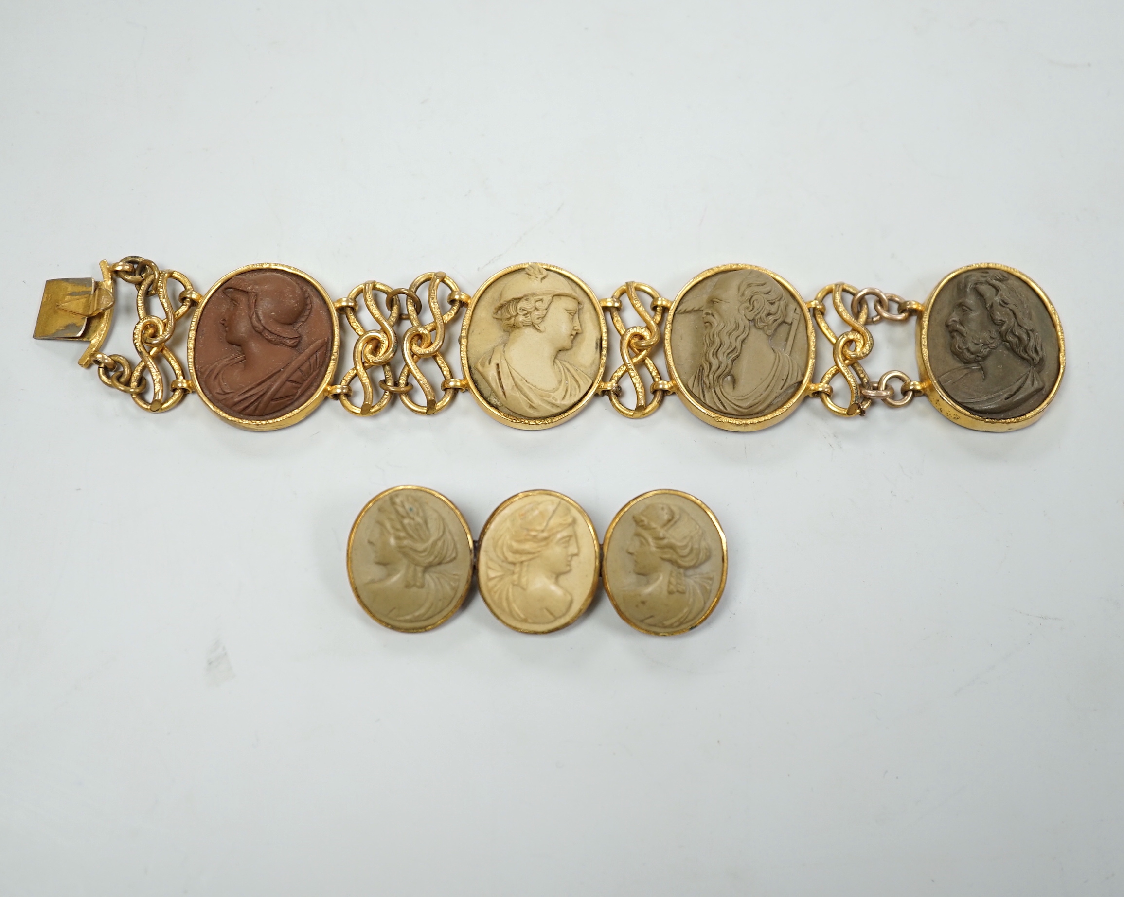 A 19th century gilt metal and oval lava panel set bracelet, 16.8cm and a similar brooch.